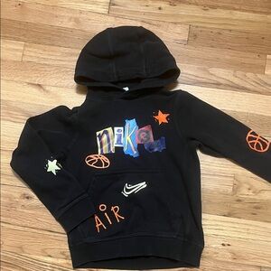 Nike Kids Black Hoodie with Vibrant Graphics Size S